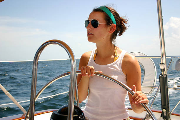 istock Woman steering sailboat 121279870