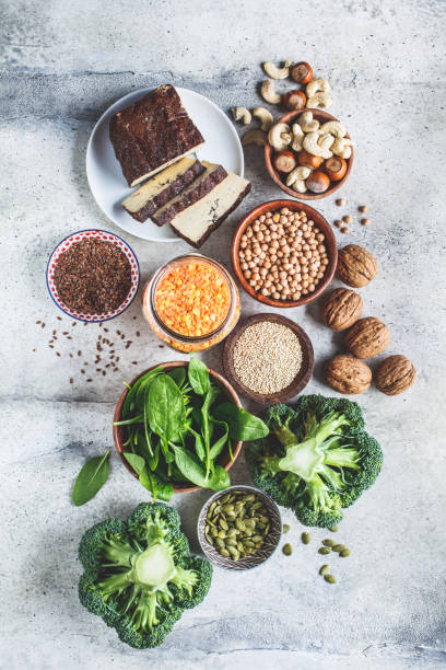 istock Vegan sources of protein, background. Tofu, chickpeas, lentils, nuts, spinach and broccoli - vegetable proteins. 1212800100