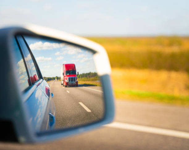 istock Truck reflected on vehicle side mirror 1212800458