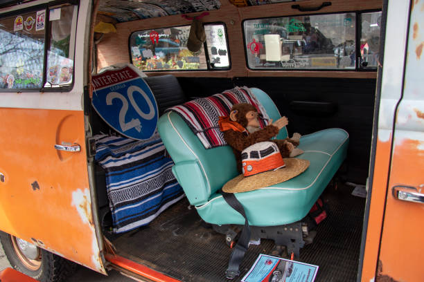 A close-up look inside the cabin of a vintage Volkswagen bus at an outdoor classic car show in Monroe, Georgia. stock photo