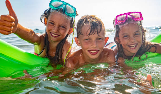 istock Kids in the water 1212801971