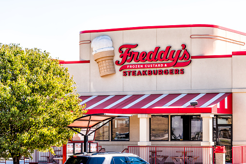 Garden City, USA - October 14, 2019: Building and sign for Freddy's frozen custard ice cream and steakburgers in Kansas small town red exterior