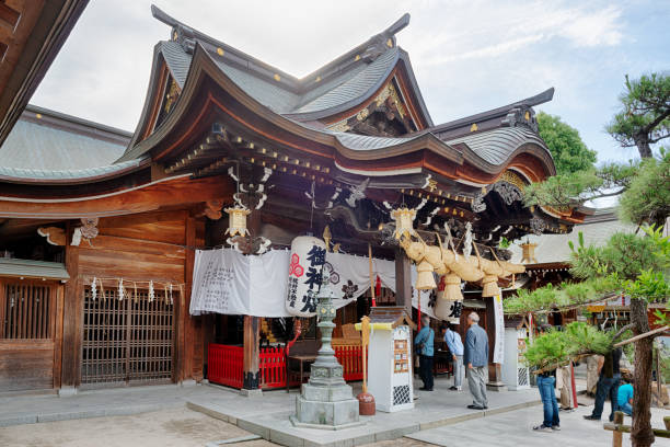 Fukuoka, Japan, May 25 2020, people praying in Kushida Shinto shrine in Japan. This shrine is one of the most famous and old in Hakata district of Fukuoka. The Hakata Gion Yamakasa festival is centered on the shrine.