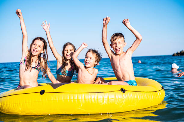 istock Happy children on the water 1212802960
