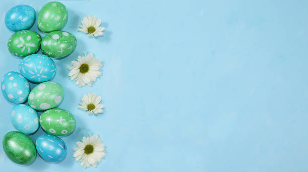 istock Decorated eggs on a trendy blue background. Minimal holiday concept. Happy Easter background,  greeting card, banner for the screen. 1212803339