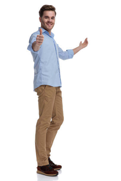 istock Positive casual man gesturing ok and presenting 1212804344