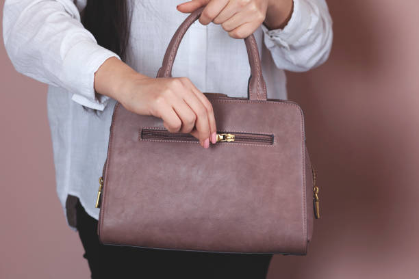 istock woman hand bag 1212806282