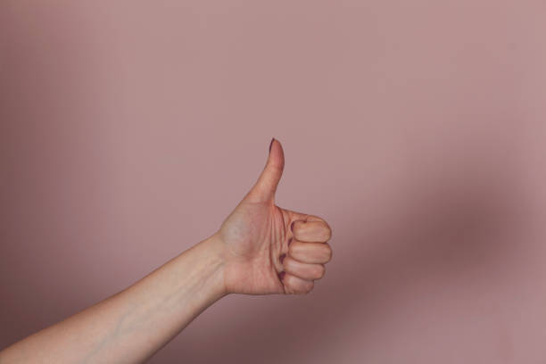 istock woman hand thumb 1212806316
