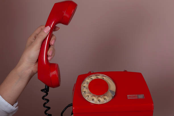 istock woman hand vintage phone 1212806324