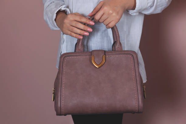 istock woman hand bag 1212807136