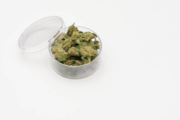 istock Marijuana cannabis Medicinal, weed joint In a glass container, drugs. 1212807174