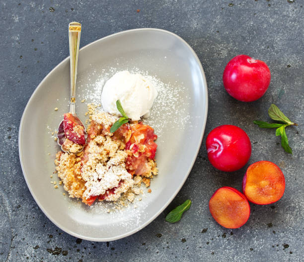 istock Plum crumble with almond crumb. 1212807198