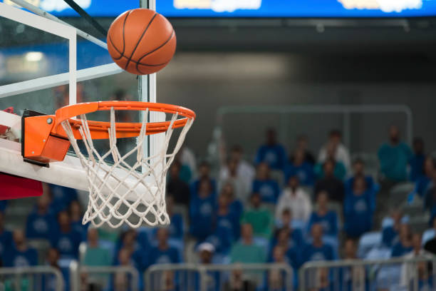 istock Basketball reaching to hoop 1212807601