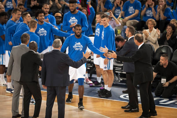 istock Basketball players shaking hands with coaches 1212807606