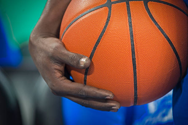 istock Player holding basketball 1212807615