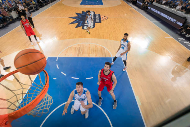 istock Basketball player aiming ball for hoop 1212807621