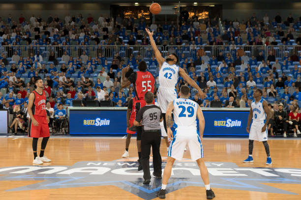 istock Basketball player jumping in the air 1212807640