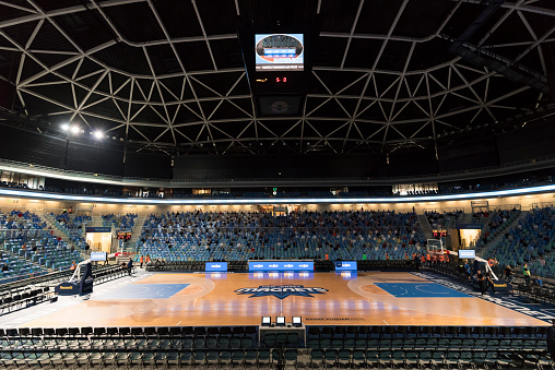 View of empty basketball court with spectators in background at Arena Stozice, Ljubljana, Slovenia.