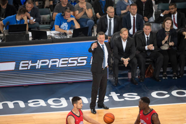 istock Coach giving instructions to basketball player 1212807647