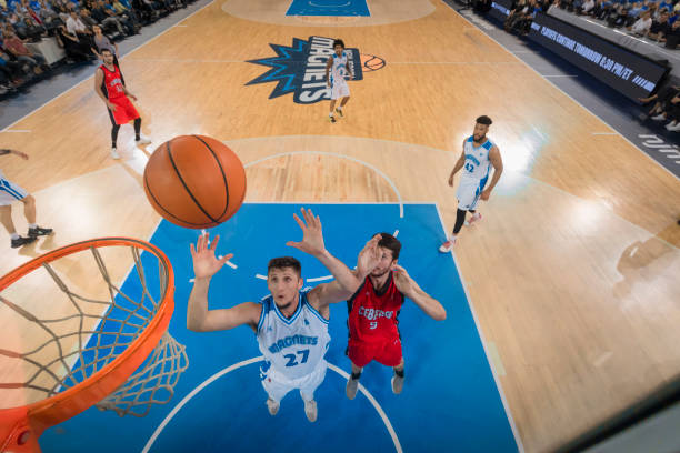 istock Basketball player aiming ball for hoop 1212807654