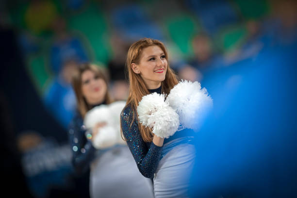 istock Cheerleader performing on basketball court 1212807700