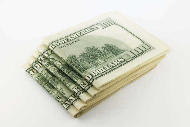 istock Stack of american money, one hundred dollar cash banknotes on white background 1212807766