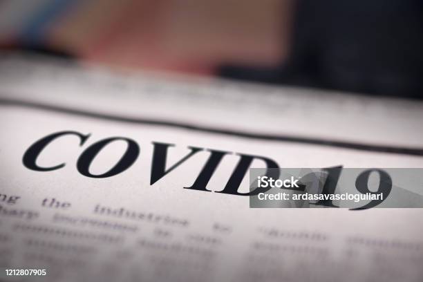 Covid19 Written Newspaper Stock Photo - Download Image Now - COVID-19, Newspaper Headline, Newspaper