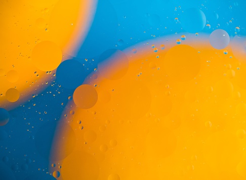 abstract background, drops of oil on water, bubbles, space fantasies, color gradient, colored circles of oil on a water surface