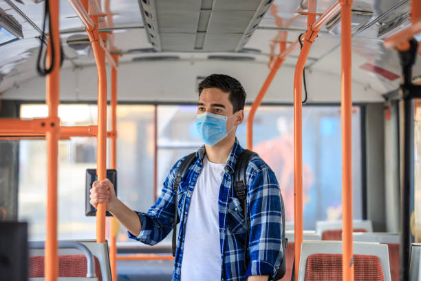 istock Worried Men With Protective Face Mask In Bus Transport. 1212809408