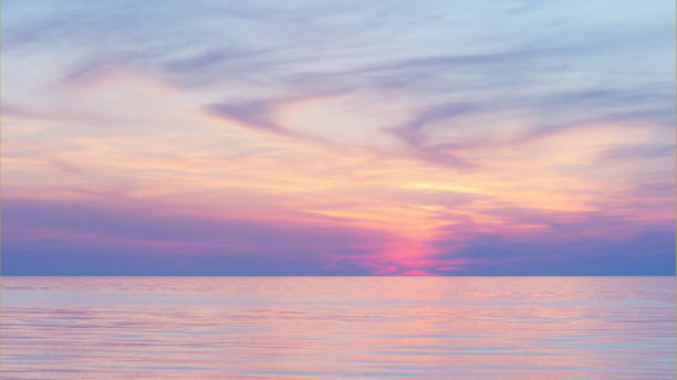 istock Twilight Dusk. Beautiful clouds over the calm sea. 1212810341