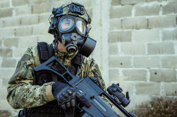 istock Soldier with gas mask 1212815347