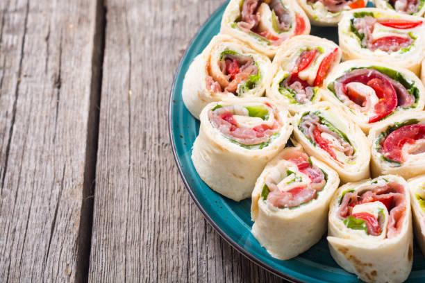 istock Sliced sandwich tortilla with vegetables and ham 1212816522