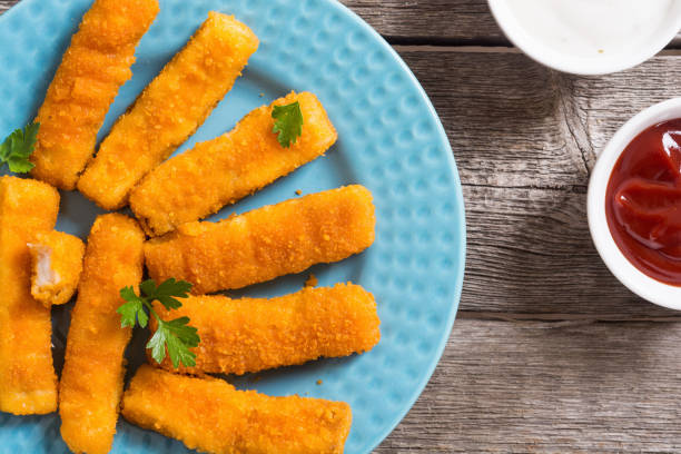 istock Fried fish sticks ( fingers ) or chicken nugget 1212816555