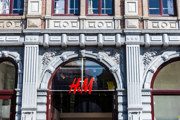 H&M clothing store in Amsterdam, Netherlands Amsterdam, Netherlands - September 7, 2018: Facade of a H&M clothing store in the center of Amsterdam, Netherlands h and m stock pictures, royalty-free photos & images