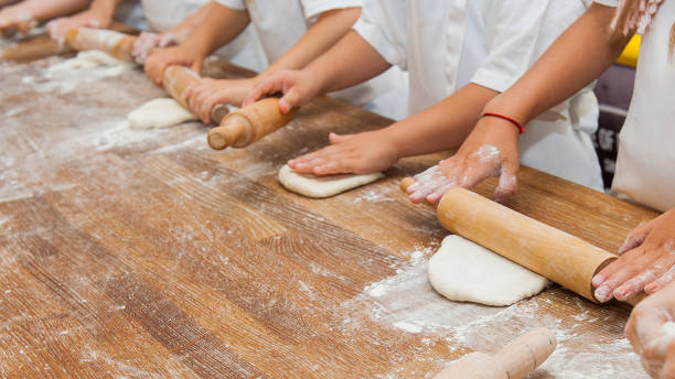 istock Young children make dough products. Hands closeup 1212819909