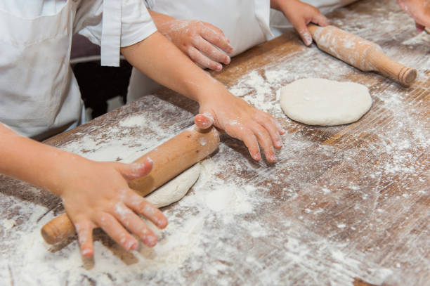 istock Young children make dough products. Hands closeup 1212819934