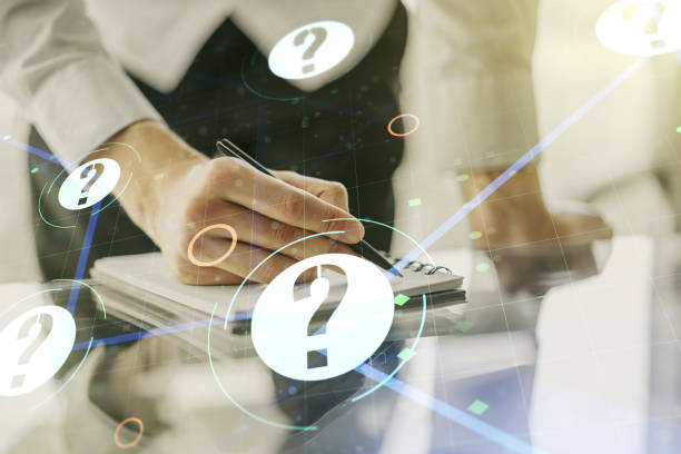 istock Creative abstract question mark sketch and man hand writing in notepad on background, FAQ and research concept. Double exposure 1212821045