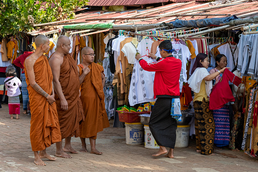 Buddhist monks inspecting the shops at Myazedi Pagoda, Bagan, Mandalay Region, Myanmar
