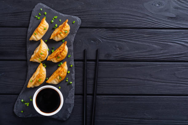 Traditional asian dumplings gyoza Traditional asian dumplings gyoza with green onion and soy sauce chinese dumpling photos stock pictures, royalty-free photos & images