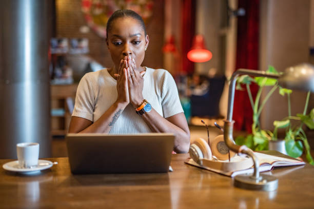 Bad news. Businesswoman reading e-mail. gross coffee stock pictures, royalty-free photos & images