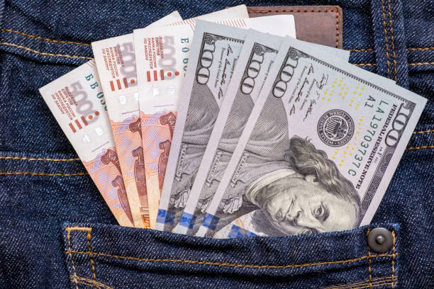 istock Russian rubles and us american dollars in a jeans pocket 1212824405