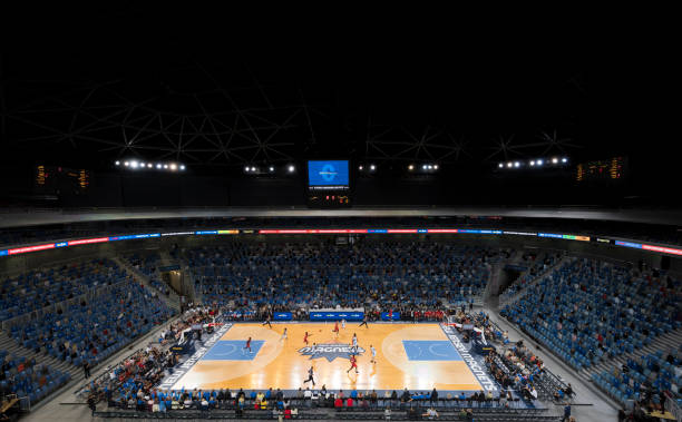 istock Basketball players playing on court 1212827840