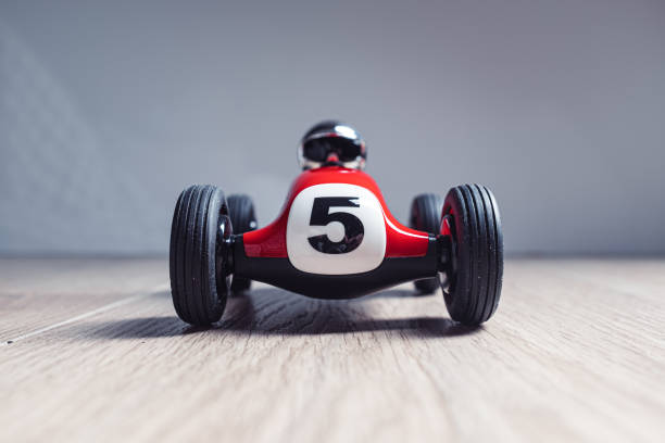 istock Red racing toy car with number five painted on it 1212828137