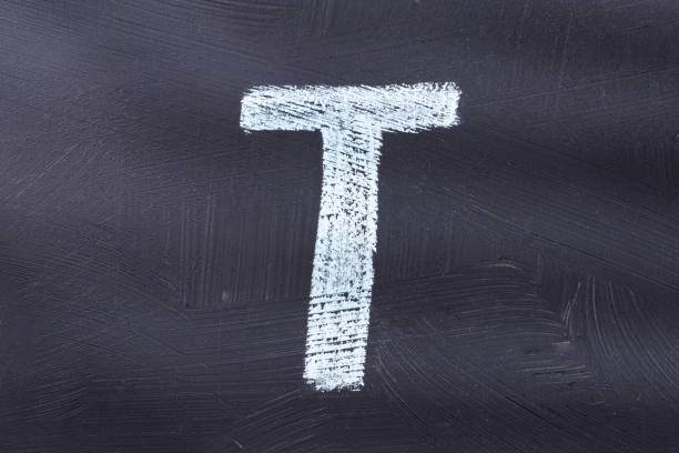 istock Letter T of the alphabet written with chalk 1212830372