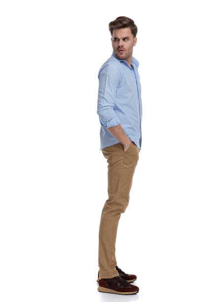 istock Side view of upset casual man looking over shoulder 1212831399