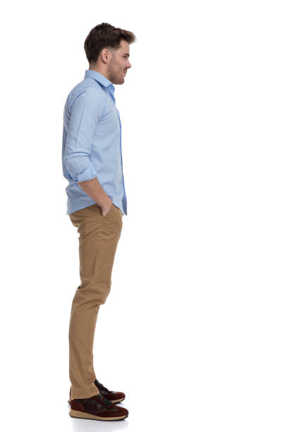 istock Side view of casual man holding both hands in pockets 1212831426
