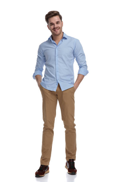 istock Positive casual man smiling with hands in pockets 1212831460
