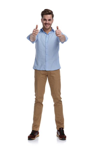istock Positive casual man giving double thumbs up and smiling 1212831505