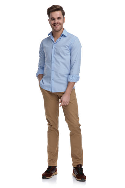 istock Positive casual man smiling with hand in pocket 1212831522