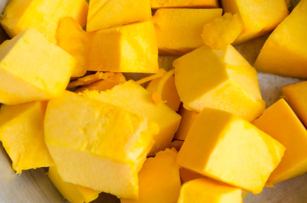 istock fresh pumpkin pulp diced in a steel plate. horizontal view 1212831809